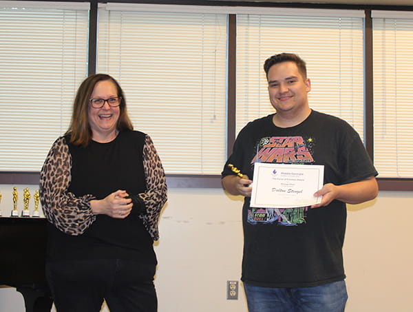 Dalton Stengel (right) receives the Force of Emotion Award from Rebecca Edwards, Senior Lecturer of Media and Communication.